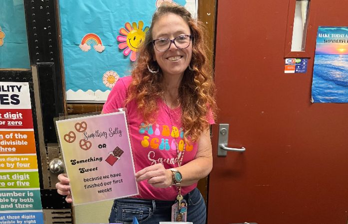 teacher holding sign